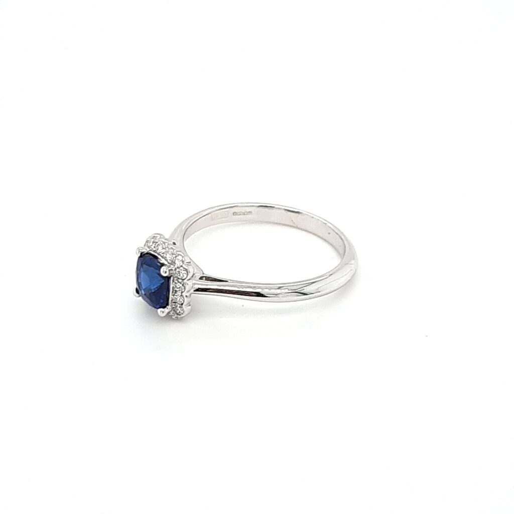 Platinum cushion cut Sapphire and Diamond cluster ring | Fosters Jewellers